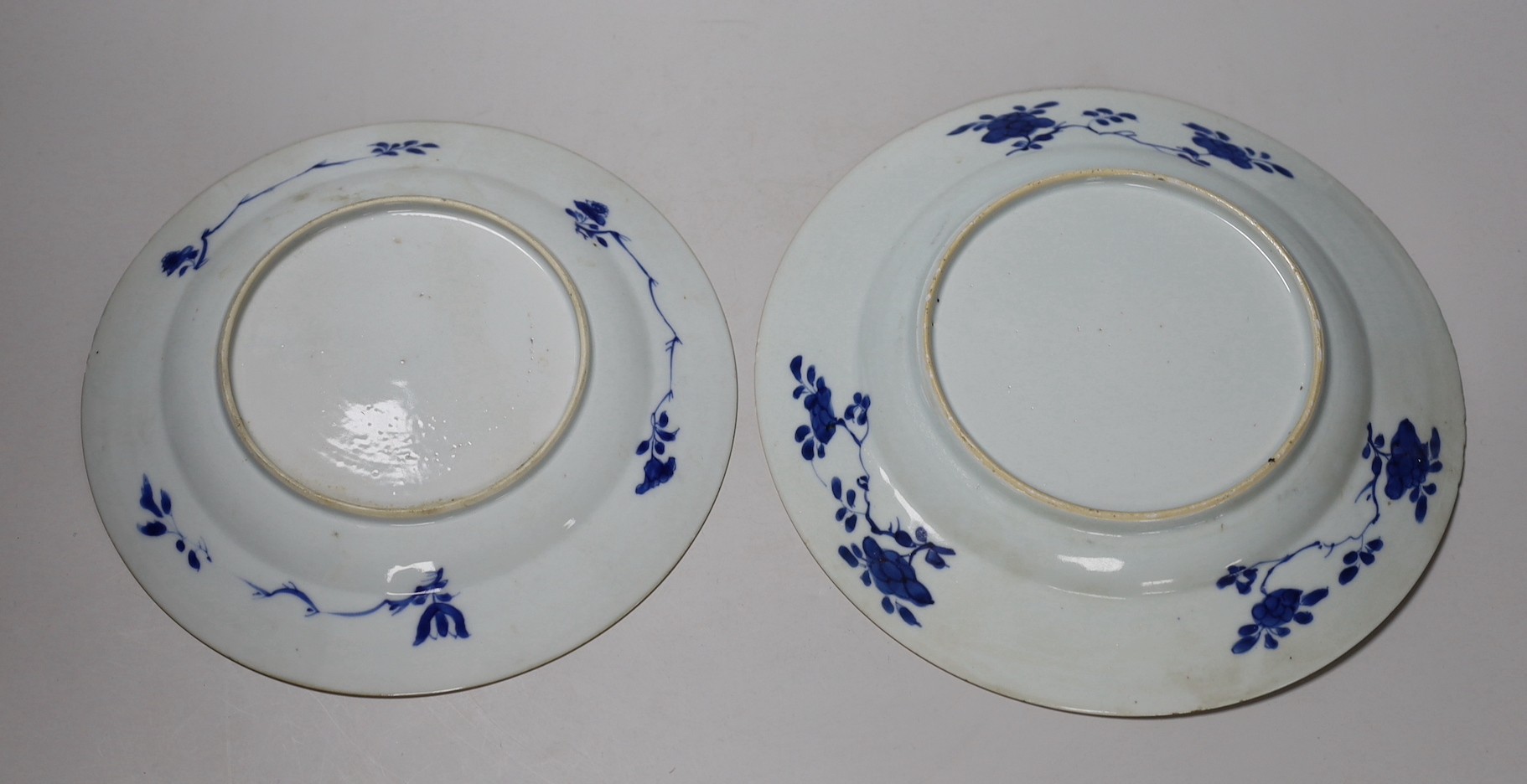 Two Chinese blue and white ‘dancing boy’ dishes, Kangxi period, largest 24.5cm, one with a border of Antiques, the other with foliage